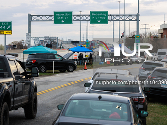 The collapsed Francis Scott Key Bridge is seen from a media staging area at the Maryland Tansportation Authority headquarters in Dundalk, Ma...