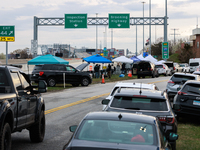 The collapsed Francis Scott Key Bridge is seen from a media staging area at the Maryland Tansportation Authority headquarters in Dundalk, Ma...