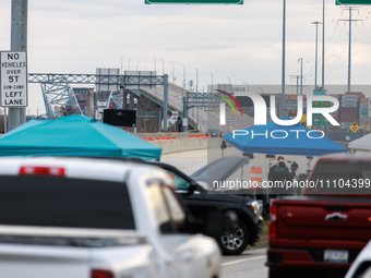 The collapsed Francis Scott Key Bridge is seen from a media staging area at the Maryland Tansportation Authority headquarters in Dundalk, Ma...