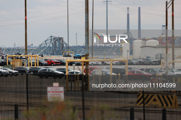 The collapsed Francis Scott Key Bridge is seen beyond the Dundalk Marine Terminal in Dundalk, Maryland on March 28, 2024. 