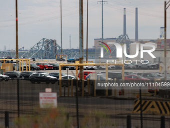 The collapsed Francis Scott Key Bridge is seen beyond the Dundalk Marine Terminal in Dundalk, Maryland on March 28, 2024. (