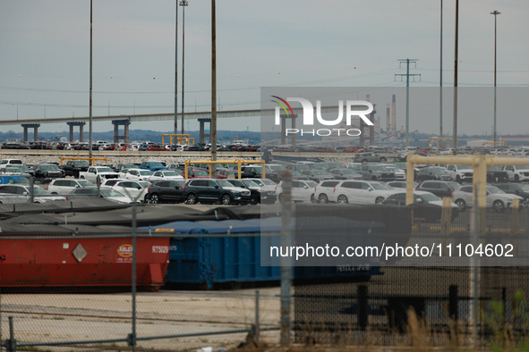 The collapsed Francis Scott Key Bridge is seen beyond the Dundalk Marine Terminal in Dundalk, Maryland on March 28, 2024. 