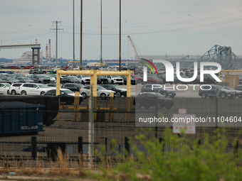 The collapsed Francis Scott Key Bridge is seen beyond the Dundalk Marine Terminal in Dundalk, Maryland on March 28, 2024. (