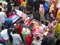 Bangladeshi Muslim people busy shopping at New Market ahead of the Eid al-Fitr festival, during the holy month of Ramadan in Dhaka, Banglade...