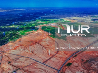 Wind power facilities are seen in Xinjiang, China, on July 14, 2019. Xinjiang is integrating wind, solar, hydro, biomass, geothermal, and na...