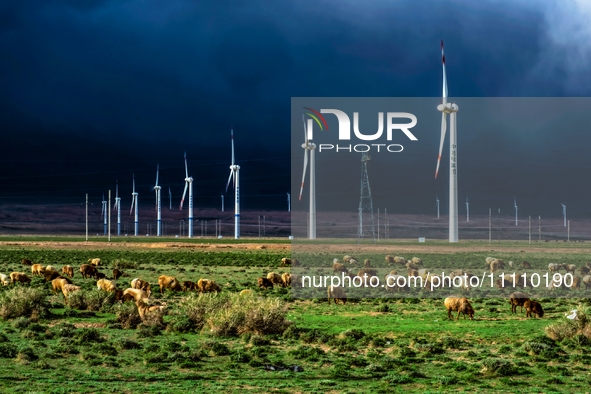 Wind power facilities are being seen in Xinjiang, China, on May 1, 2017. Xinjiang is integrating wind, solar, hydro, biomass, geothermal, an...