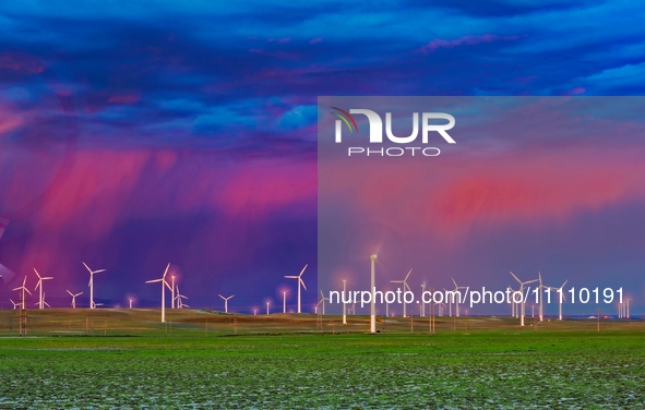 Wind power facilities are being seen in Xinjiang, China, on May 24, 2020. Xinjiang is integrating wind, solar, hydro, biomass, geothermal, a...