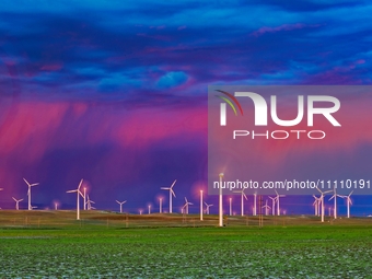 Wind power facilities are being seen in Xinjiang, China, on May 24, 2020. Xinjiang is integrating wind, solar, hydro, biomass, geothermal, a...