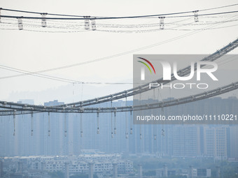 Workers are working at the construction site of Jinzhou Bridge in Xingyi, China, on March 31, 2024. (