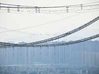 Workers are working at the construction site of Jinzhou Bridge in Xingyi, China, on March 31, 2024. (