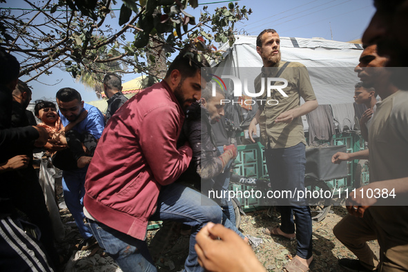 Paramedics are transporting a wounded Palestinian at the Al-Aqsa Martyrs Hospital in Deir al-Balah in the central Gaza Strip, following an I...