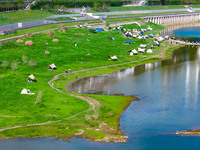 Tourists are camping and playing on the river beach as the water levels of the Yangtze and Jialing rivers continue to fall in Chongqing, Chi...