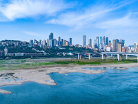 Tourists are camping and playing on the river beach as the water levels of the Yangtze and Jialing rivers continue to fall in Chongqing, Chi...