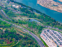 Tourists are camping and playing on the river beach as the water levels of the Yangtze and Jialing rivers continue to fall in Chongqing, Chi...