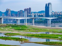 Tourists are camping and playing on the river beach as the water levels of the Yangtze and Jialing rivers continue to fall in Chongqing, Chi...