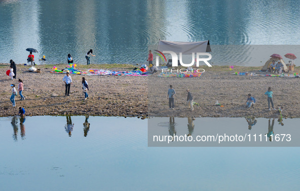 Tourists are camping and playing on the river beach as the water levels of the Yangtze and Jialing rivers continue to fall in Chongqing, Chi...