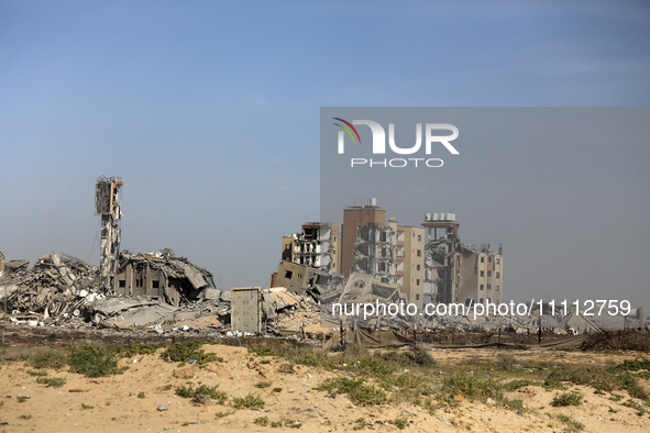 A damaged building in the Asra residential compound, northwest of Nuseirat, is shown in the Gaza Strip, on April 1, 2024, amid the ongoing c...