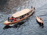 Bangladeshi People Cross On Boat Over The Pitch Black Water Of The Polluted Buriganga River In Dhaka, Bangladesh, On April 2, 2024. Banglade...