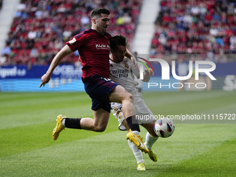 Jesus Areso right-back of Osasuna and Spain and Brahim Diaz attacking midfield of Real Madrid and Spain compete for the ball during the LaLi...