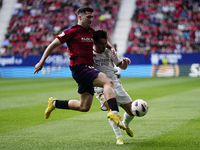 Jesus Areso right-back of Osasuna and Spain and Brahim Diaz attacking midfield of Real Madrid and Spain compete for the ball during the LaLi...