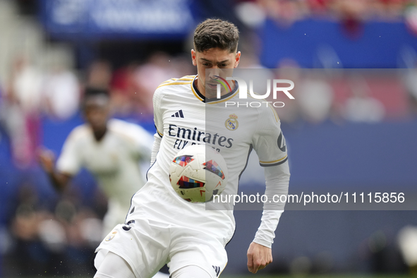 Federico Valverde central midfield of Real Madrid and Uruguay controls the ball during the LaLiga EA Sports match between CA Osasuna and Rea...