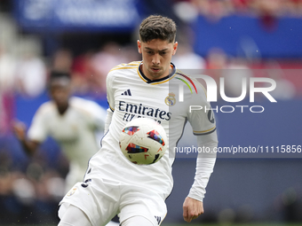 Federico Valverde central midfield of Real Madrid and Uruguay controls the ball during the LaLiga EA Sports match between CA Osasuna and Rea...