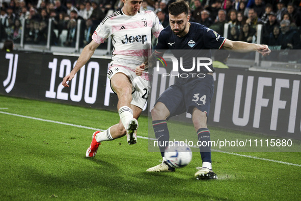 Lazio defender Mario Gila (34) is fighting for the ball against Juventus defender Andrea Cambiaso (27) during the Coppa Italia semi-final fo...