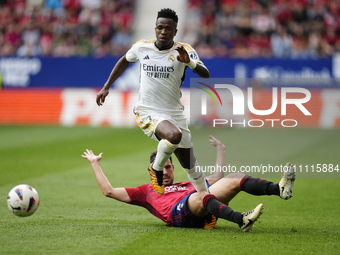 Vinicius Junior left winger of Real Madrid and Brazil and Unai Garcia centre-back of Osasuna and Spain compete for the ball during the LaLig...