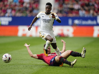 Vinicius Junior left winger of Real Madrid and Brazil and Unai Garcia centre-back of Osasuna and Spain compete for the ball during the LaLig...