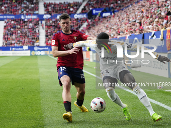 Ferland Mendy left-back of Real Madrid and France and Jesus Areso right-back of Osasuna and Spain compete for the ball during the LaLiga EA...