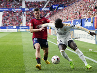 Ferland Mendy left-back of Real Madrid and France and Jesus Areso right-back of Osasuna and Spain compete for the ball during the LaLiga EA...