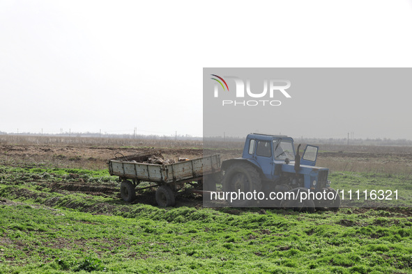 A tractor is being seen in the field where the MinesEye unmanned system for the detection of mines and explosive devices is being tested as...