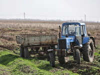 A tractor is being seen in the field where the MinesEye unmanned system for the detection of mines and explosive devices is being tested as...