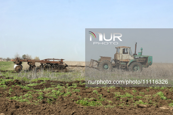 A tractor is being seen in the field where the MinesEye unmanned system for the detection of mines and explosive devices is being tested as...