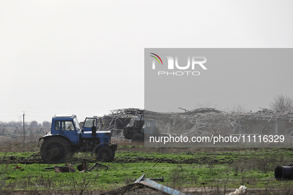 A tractor is being seen in the field where the MinesEye unmanned system for the detection of mines and explosive devices is being tested as...