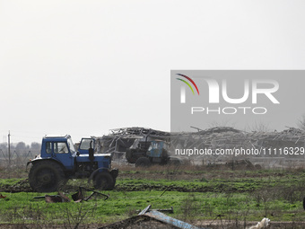 A tractor is being seen in the field where the MinesEye unmanned system for the detection of mines and explosive devices is being tested as...