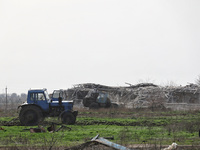 A tractor is being seen in the field where the MinesEye unmanned system for the detection of mines and explosive devices is being tested as...