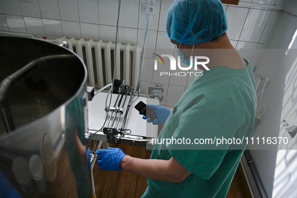 A chemist is producing medicinal hydrogel dressings to speed up the healing process of burns and severe wounds in Ukrainian soldiers at Lviv...