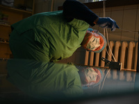 Professor Volodymyr Samaryk, Doctor of Chemical Sciences, is looking into the dehydration furnace during the production of medicinal hydroge...