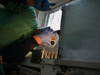 A chemist is looking into the dehydration furnace during the production of medicinal hydrogel dressings for Ukrainian soldiers at Lviv Polyt...