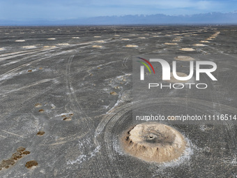 An aerial view is showing Karez, an ancient water project that is using the slope of the ground to extract groundwater without power, in an...