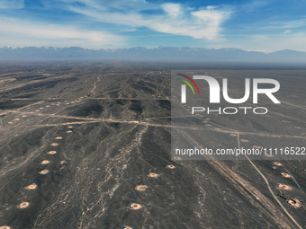 An aerial view is showing Karez, an ancient water project that is using the slope of the ground to extract groundwater without power, in an...