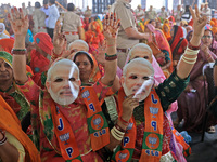 In Jaipur, Rajasthan, India, on April 2, 2024, BJP supporters are wearing face masks of PM Narendra Modi during a public meeting ahead of th...