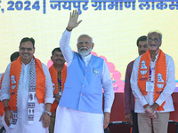 Prime Minister Narendra Modi is with Rajasthan Chief Minister Bhajan Lal Sharma, showing support for BJP Jaipur Rural candidate Rao Rajendra...