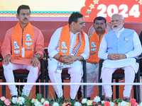 Prime Minister Narendra Modi is with Rajasthan Chief Minister Bhajan Lal Sharma at a public meeting ahead of the Lok Sabha election in Kotpu...