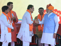 Prime Minister Narendra Modi is with Rajasthan Chief Minister Bhajan Lal Sharma during the public meeting ahead of the Lok Sabha election, i...