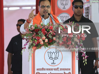 Rajasthan Chief Minister Bhajan Lal Sharma is addressing a public meeting ahead of the Lok Sabha election in Kotputali, Jaipur, Rajasthan, I...