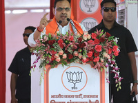 Rajasthan Chief Minister Bhajan Lal Sharma is addressing a public meeting ahead of the Lok Sabha election in Kotputali, Jaipur, Rajasthan, I...