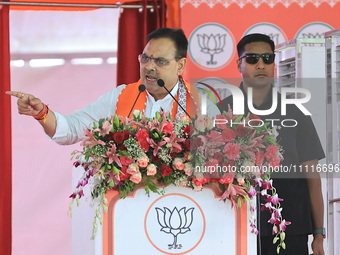 Rajasthan Chief Minister Bhajan Lal Sharma is addressing a public meeting ahead of the Lok Sabha election in Kotputali, Jaipur, Rajasthan, I...