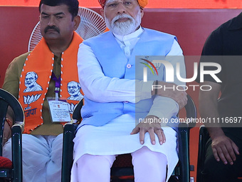 Prime Minister Narendra Modi is speaking at a public meeting ahead of the Lok Sabha election in Kotputali, Jaipur, Rajasthan, India, on Apri...